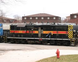 Here we see another IAIS oddity - the only high-hood geep in IAIS paint still running. Having just drug it out of the shop, it looks like they're trying to get it started again.