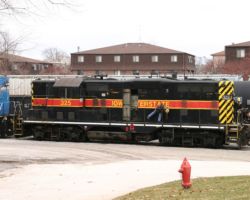 Here we see another IAIS oddity - the only high-hood geep in IAIS paint still running. Having just drug it out of the shop, it looks like they're trying to get it started again.