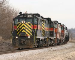 413 and its oddball cab light round the bend at Atalissa on the day after Christmas