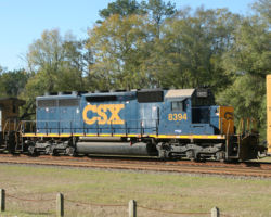 Trailing behind 9033 on Q601 is SD40-2 #8394 in "dark future" paint
