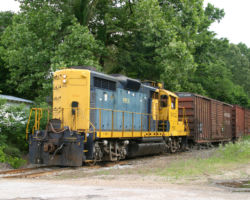 Next stop, Michigan City. Once again, the train emerges from the trees for a few hundred feet and immediately disppears again after crossing the road.