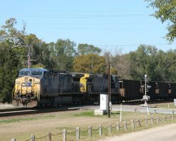 Before I can get moved over to the park on the west side (behind the old depot), more trains show up. Here's CSXT 140 and 33 southbound with a coal train at 1309h.