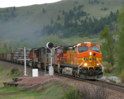 An empty PG&E coal train rolls towards Mullan Pass at Avon, MT.