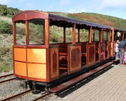 The outsides of one of the wooden coaches at the Sea Lion Rocks platform. Note the link-and-pin couplings.