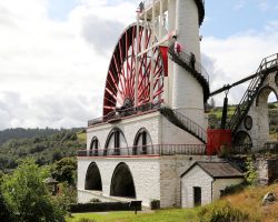 The back side of the wheel, showing the tower that feeds water to the top, as well as carries the staircase. Tourists have been climbing to the top since the Victorian days.