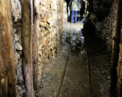 Inside the old adit, showing the 19" gauge tracks in the floor.