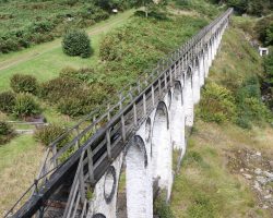 Looking down the power transmission viaduct from the top of the wheel. At the far end is where the rod turns 90 degrees and goes down the Engine Shaft of the mine.