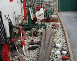 An assortment of railway tools and supplies.  Wait, I see insulators...