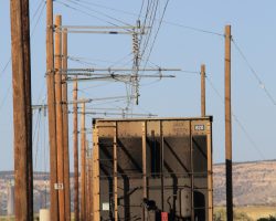 Bringing up the rear under wire is one of the JAIX aluminum coal hoppers that was acquired in recent years to replace wrecked and worn out hoppers.