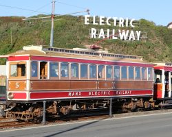 MER #5, one of the 1894 cars, finishes up its run into Derby Castle under the famous "Electric Railway" sign on the hillside.