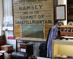 Another piece of vintage advertising for the railway, along with a rotor out of a traction motor sitting on the wood platform below.