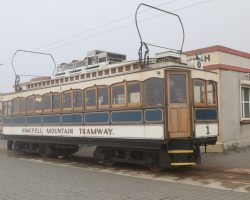 Here's car #1 sitting in front of the summit station. Within the last ten minutes, the fog has rolled in and it's now raining and cold. Note the unusual bow-style collectors on top the car instead of trolley poles. These are used apparently because the winds up here will get the trolley wire bouncing and can knock off a conventional trolley pole.