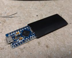 Program an Arduino Pro Micro with the sketch, and then fit it inside a sleeve of 45mm heat shrink tubing for insulation