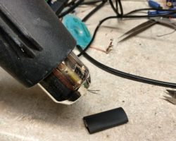 Apply low heat to the assembly to tighten up the heat shrink.