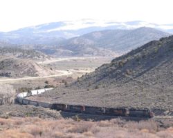 Finally, after being up for almost 5 hours, the day's MPUAA (Pueblo-Alamosa Manifest) rounds this curve just east of Fort Garland. It's nearing 1000h, and the train is at least several hours late. I've always wanted this shot, but normally it can't be had because the train passes this point far before sunrise. Now if only the sun was in the west.