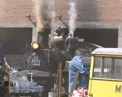 But not all is quiet in Chama - 487, the first of the fleet to be rebuilt, takes on a little sand before the day's trip.