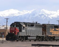 While the road crew (Pueblo-Alamosa) tied up and turned over their duties to the south local (LDP53 in UP-speak) crew, I headed west to look at the San Luis Central. I arrived back at Alamosa right on time, as LDP53 was coming through the yard to head for Antonito, seen here set against the Sangre de Cristo Range in the background. Unfortunately, the Grande is trailing.
