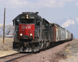 A few miles south of Alamosa, SSW 7286 picks its way along the the light-railed, but well-maintained, Antonito branch. Following it are DRGW 3128 and 24 empties for the operations at the end of the branch.