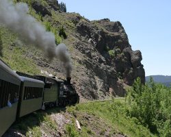 Nearing the summit at Cumbres, the train is just about to round Windy Point.