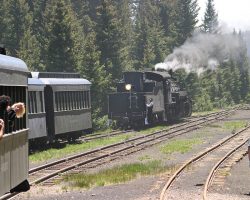 Since 487 was doing all it could to drag our train up the four percent grade from Chama, the open-air observations were left at Cumbres summit for us to pick up once we'd crested the hill. Here, 487 is cut off and retrieving the two flats and two coaches.