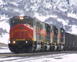 Utah 5005 and train cresting Soldier Summit in the snow