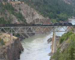 Just out of Lillooet, the railway crosses the bridge over the mighty Fraser to jump from the west to the east bank. The bridge is easily photographed from pullouts on Hwy 97.