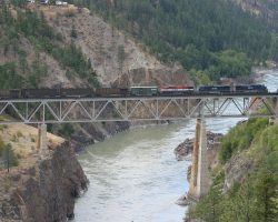 Just out of Lillooet, the railway crosses the bridge over the mighty Fraser to jump from the west to the east bank. The bridge is easily photographed from pullouts on Hwy 97.