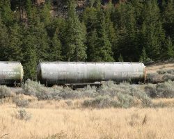 An old BCR tanker, encrusted with some sort of dirt or mineral, sits on the spur at Pavilion