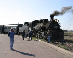 Finally at the end of the day's run, 487 and train stop in Antonito about 1745h. 487 sits for photo ops with the passengers while our two crewmen wander out of the photo.