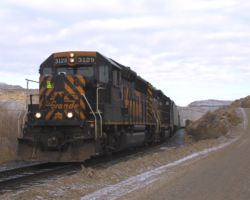 A little grainy, DRGW 3129 comes around a curve near Dominguez