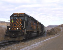 A little grainy, DRGW 3129 comes around a curve near Dominguez
