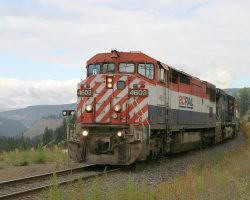 The 4603 and late PGSQ pass the entrace to the park in Williams Lake - and finallly, after several days of continuous gloom, you can see sunlight in the background!
