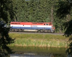 Not really the shot I wanted, but not a bad view of 4613 reflecting off a lake, bracketed by trees near Enterprise.