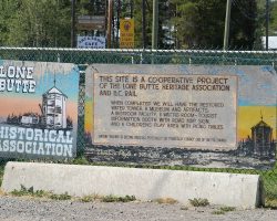 A sign about the Lone Butte Historical Foundation's efforts to save, restore, and reuse the PGE's watertower and surrounding area.
