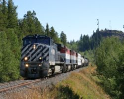 SQJO and 4652 approach the town of Lone Butte, with the town's namesake geologic landmark in the background.