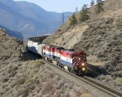 Passing through a cut and over a fill, high above the Fraser near Gibbs.