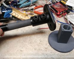 The Steel-Tek flange and pipe, with the 3D-printed mount adapter.
