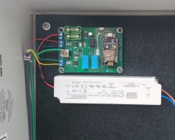 The control board and power supply installed inside the box on the pole