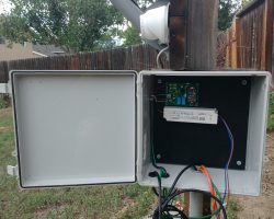 A wider view of the box on the satellite pole, showing the control board installed.