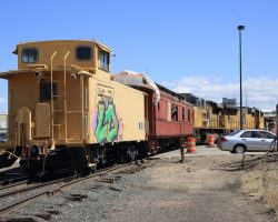 Probably one of the only times a pair of SD70s has been tied to a wooden passenger coach and a caboose.
