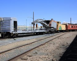 The first step was to pull the derrick out such that the caboose and wooden passenger car could be shoved back in that same track.