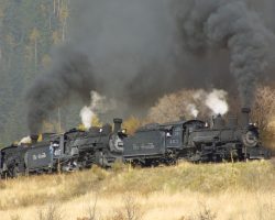 After cutting the power apart and taking each unit over the Lobato trestle separately (it won't safely support the weight of more than one of these larger narrow gauge engines at a time), the three are back together and pounding uphill again.