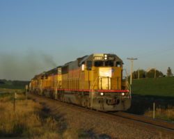 Just a bit further west of the previous shot, UP 5997 rounds a curve and approaches Arlington, NE.