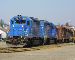 EMDX 6412 and 6413 sit on the NWP at Petaluma, behind the depot. These units apparently are kept around for whenever anything north of here actually opens up and mainline freights begin operating again. Until then, NWPY 171, a switcher, is handling the traffic.