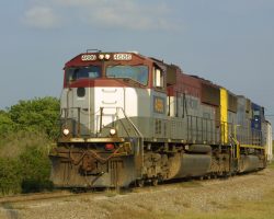 A patched EMD unit sits near the Green Bay Mine waiting to depart on 6-May.