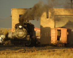 The evening light makes CATS 489 look great against the storm in the background at Antonito, CO. 489 has been cut off the eastbound train and turned for Sunday's movement back west.