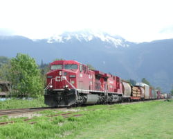 A westbound mixed accelerates out of a slow order, headed for Vancouver
