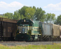 Northbound CFNR 104 passes some rather odd cars near Delavan, CA, on 22-Aug-2001.