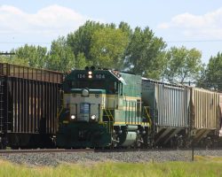 Northbound CFNR 104 passes some rather odd cars near Delavan, CA, on 22-Aug-2001.