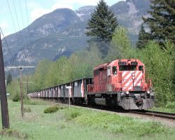 A mangey-looking SD40-2 with a ballast train, north of Hope, BC
